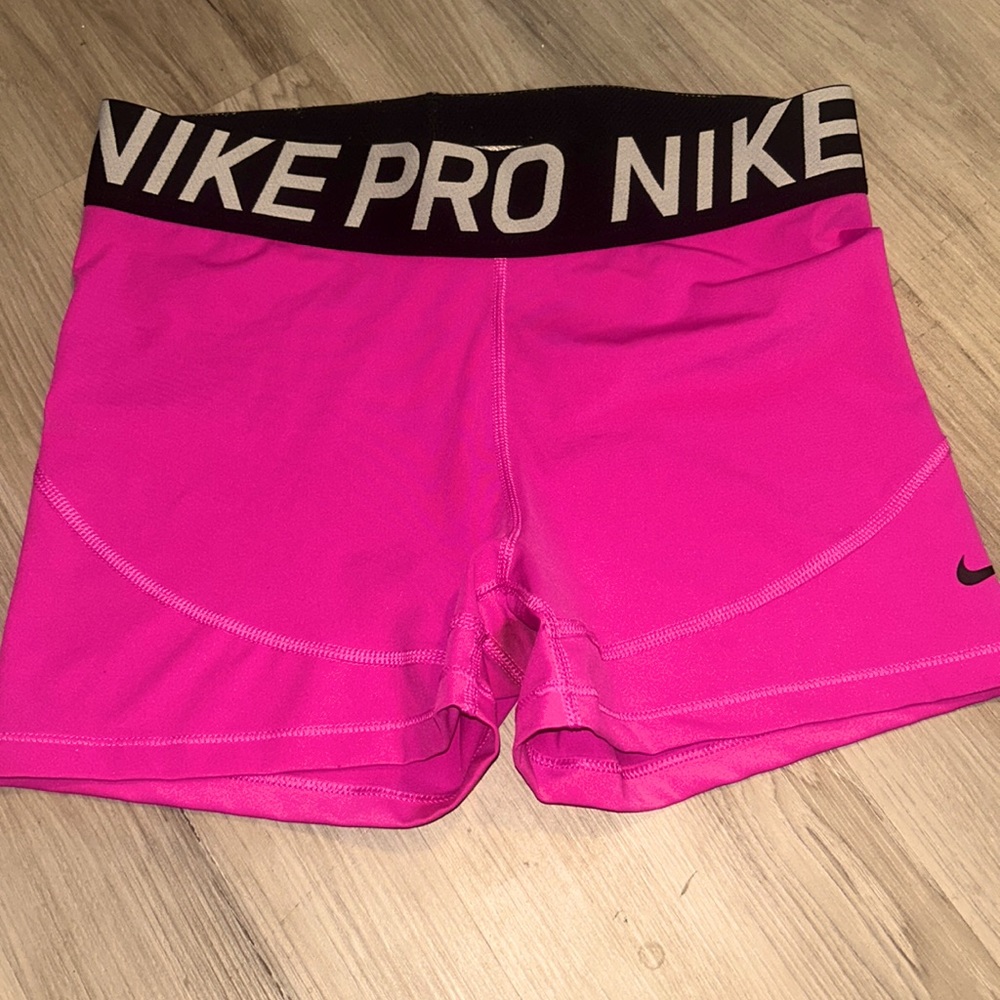 Pink black and white Nike pros shorts. Size large.